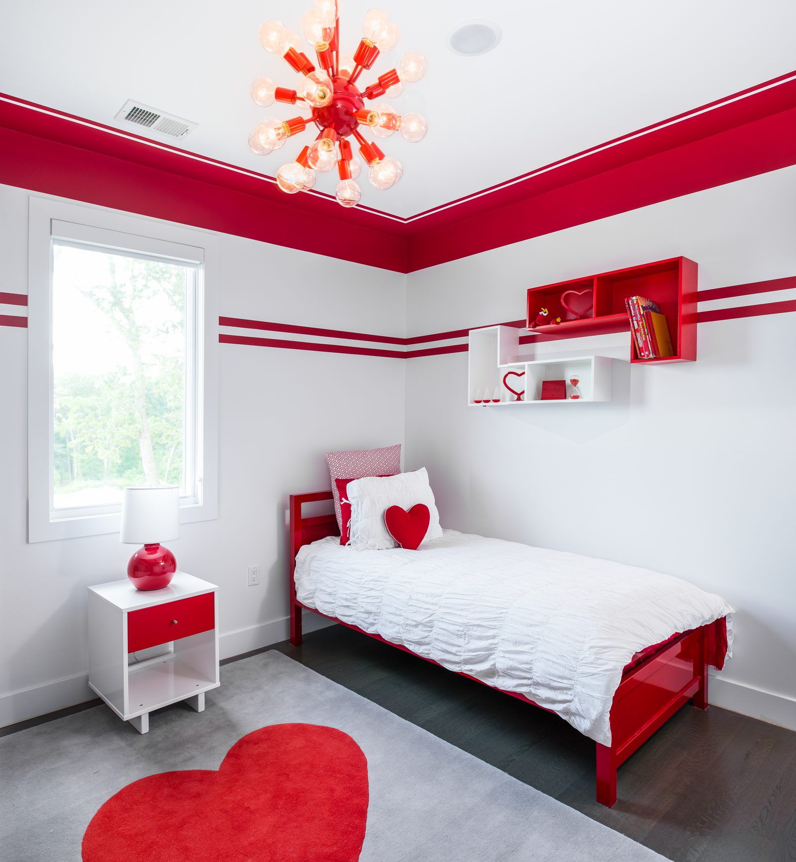 Red themed bedroom with sputnik chandelier