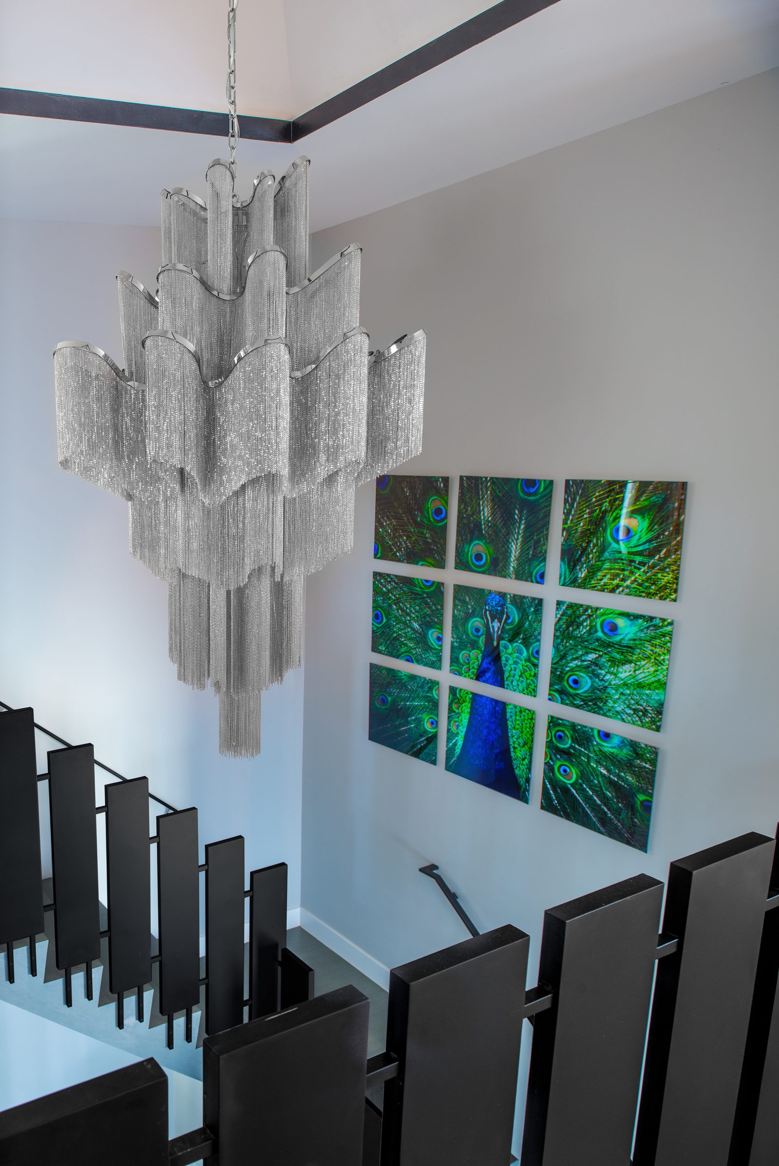 Grand staircase with cascading chain chandelier